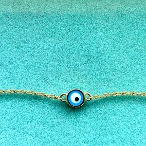 Dainty evil eye bracelet in 14k yellow gold